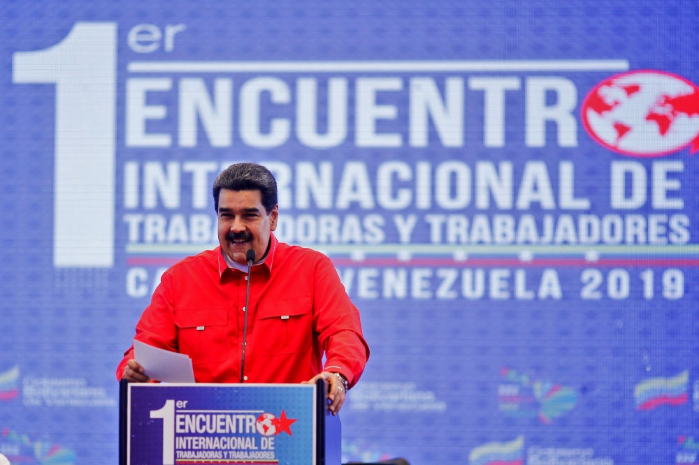 Handout photo released by the Venezuelan Presidency showing Venezuelan President Nicolas Maduro speaking during the 1st International Meeting of Workers in Caracas, on August 30, 2019.   AFP 