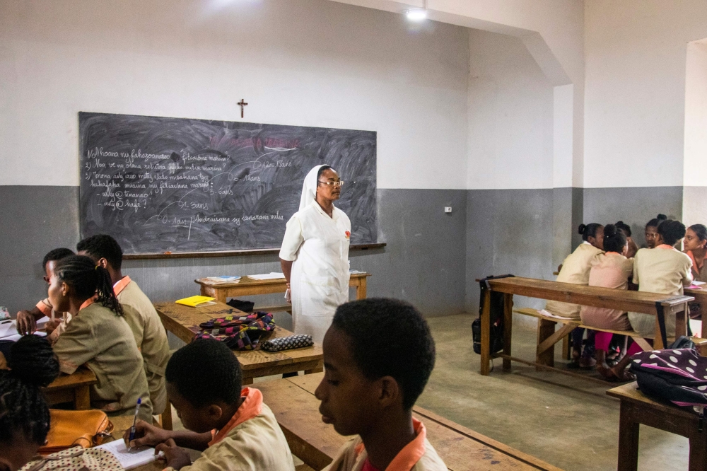 A Catholic nun teaches a class at the Saint-Jean Catholic High School, a school that accepts also pupils of Muslim religion, on July 26, 2019 in Antsiranana also known as Diego-Suarez. AFP / Fita Fanomezantsoa 
