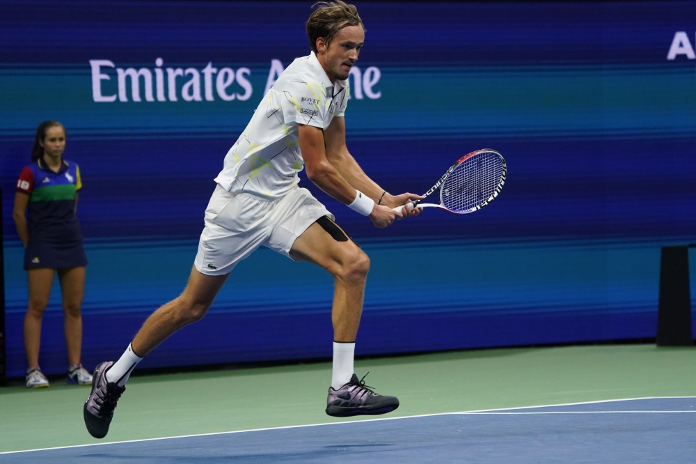 Daniil Medvedev of Russia runs for the ball during his match against Grigor Dimitrov of Bulgaria during their Singles Men's Semi-finals match at the 2019 US Open at the USTA Billie Jean King National Tennis Center in New York on September 6, 2019. / AFP /