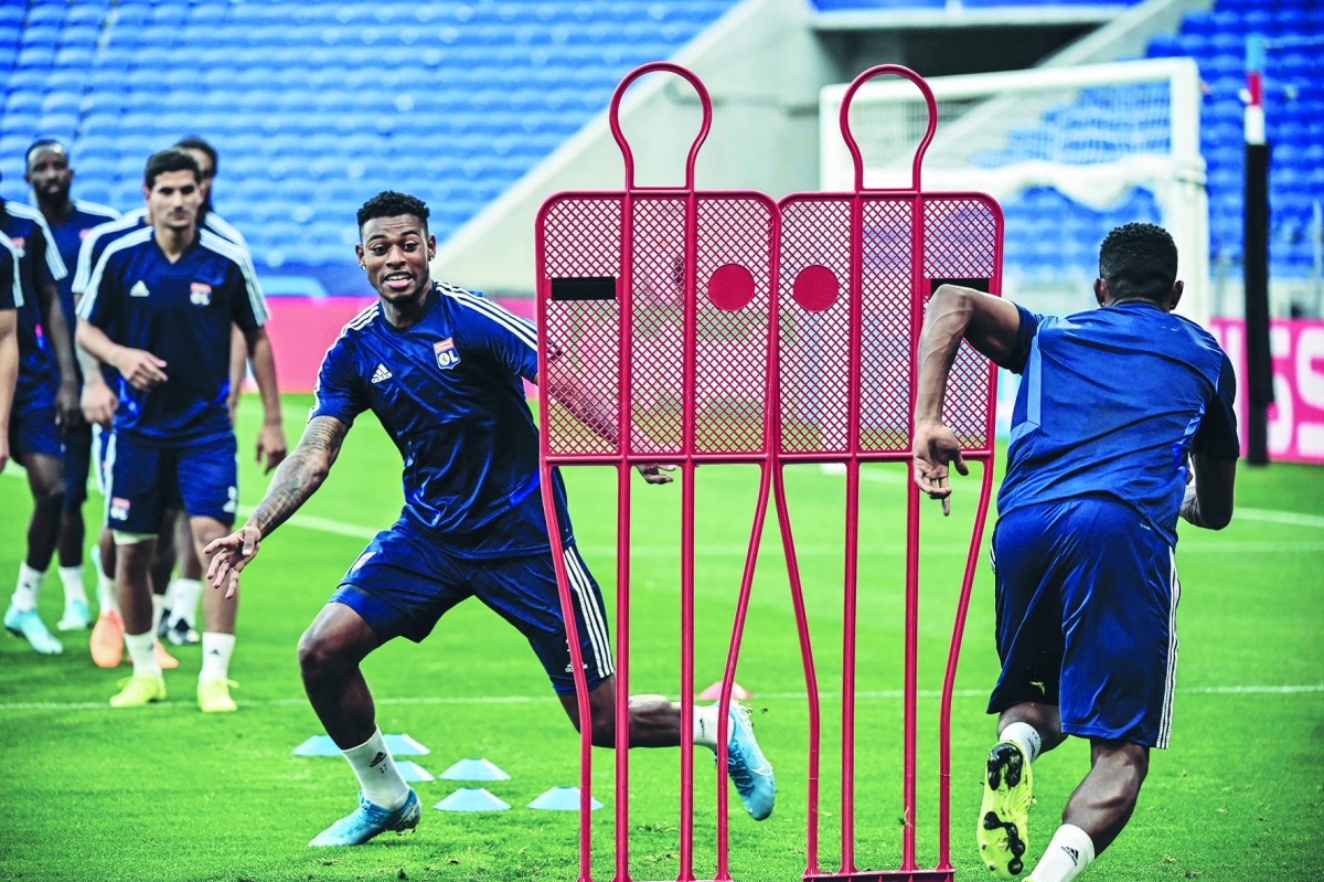 Lyon's players Lyon's French midfielder Jeff Reine-Adelaide (L) takes part in a training session at the Groupama Stadium in Decines-Charpieu, near Lyon, on September 16, 2019, on the eve of the UEFA Champions League football match Olympique Lyonnais (OL) 