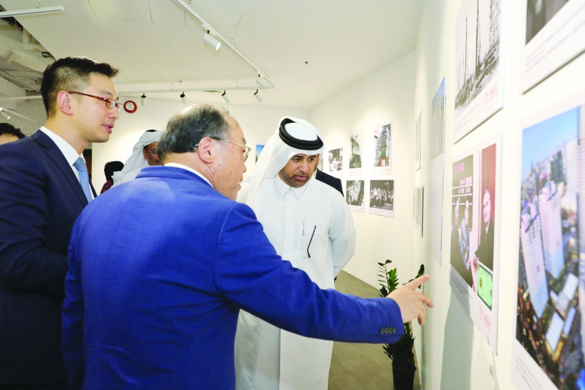 Dr. Khalid bin Ibrahim Al Sulaiti (right), General Manager of Katara, viewing some of the photos showcased at the opening of “Moments in History, 70 Years  of Shanghai” exhibition at Katara Building 47 on Sunday.