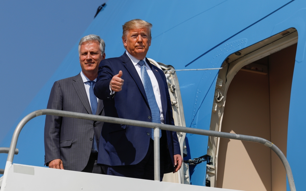 U.S. President Donald Trump gives a thumbs up as he boards Air Force One with his newly announced White House national security adviser Robert O'Brien at Los Angeles International Airport in Los Angeles, California, U.S., September 18, 2019. REUTERS/Tom B