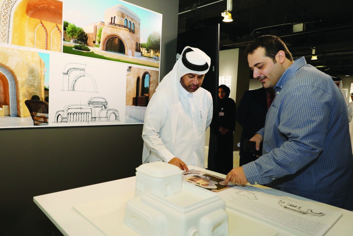 Syrian artist and architect, Muhannad Barakat (right), explains one of his works to Dr. Khalid bin Ibrahim Al Sulaiti, General Manager of Katara, at the opening of his exhibition dubbed “Art of Nature in the Qatari Architecture” which opened on Wednesday 