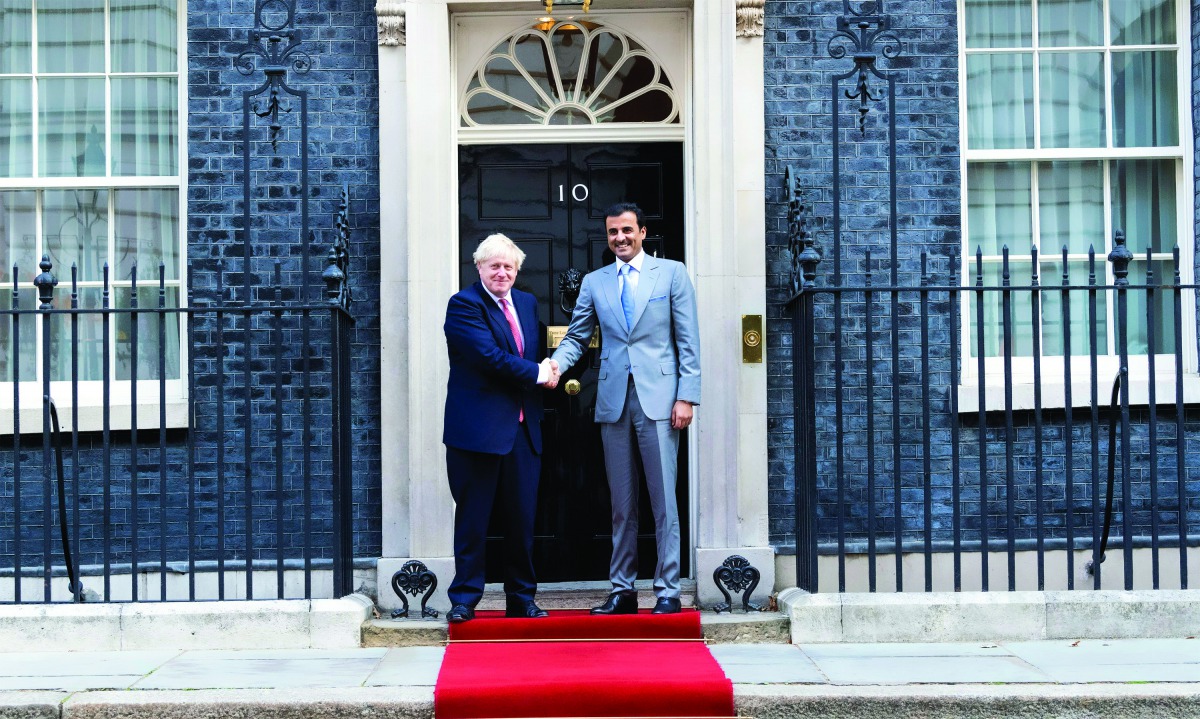Amir H H Sheikh Tamim bin Hamad Al Thani with Prime Minister of the United Kingdom, Boris Johnson, during a meeting at the British Prime Minister’s office on 10 Downing Street, in London, yesterday. 