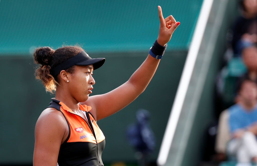 Japan's Naomi Osaka gestures. REUTERS/Kim Kyung-Hoon
