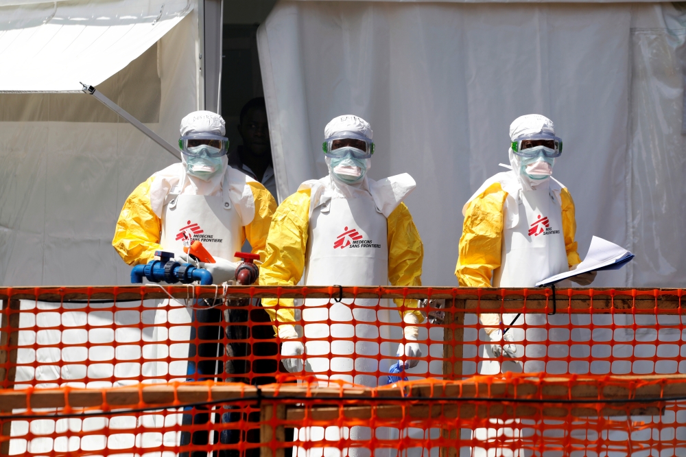 FILE PHOTO: Health workers dressed in protective suits are seen at the newly constructed MSF(Doctors Without Borders) Ebola treatment centre in Goma, Democratic Republic of Congo, August 4, 2019.REUTERS/Baz Ratner