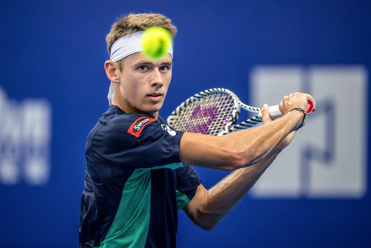 Alex de Minaur of Australia hits a return against compatriot John Millman during their men's singles first round match at the Zhuhai Championships tennis tournament in Zhuhai in China's southern Guangdong province on September 24, 2019. AFP 