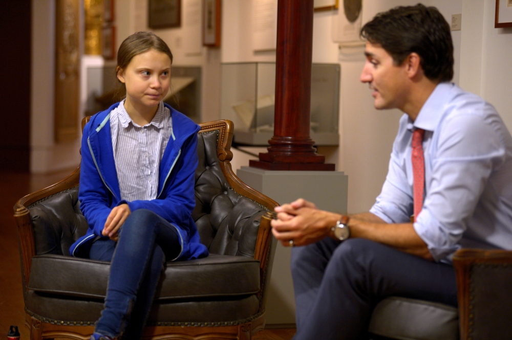 Canada's Prime Minister Justin Trudeau greets Swedish climate change teen activist Greta Thunberg before a climate strike march in Montreal, Quebec, Canada September 27, 2019. Reuters/Andrej Ivanov