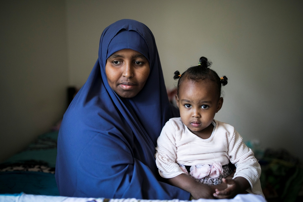 Ramlo Ali Noor, whose immediate family is affected by the Trump administration's cap on refugee numbers, poses at her apartment with her daughter Sumayo in Columbus, Ohio, US September 27, 2019. Reuters/Maddie McGarvey