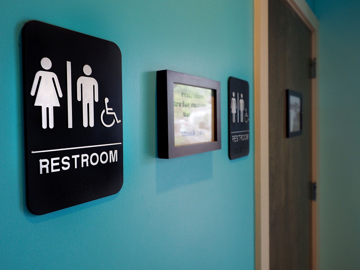 Unisex signs hanging outside bathrooms at Toast Paninoteca in Durham, North Carolina, May 9, 2016.  AFP / Getty Images North America / Sara D Davis
