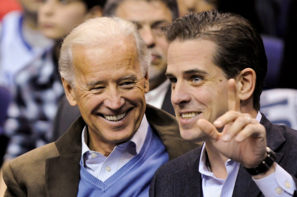 Joe Biden and his son Hunter Biden attend an NCAA basketball game between Georgetown University and Duke University in Washington, January 30, 2010. Reuters/Jonathan Ernst