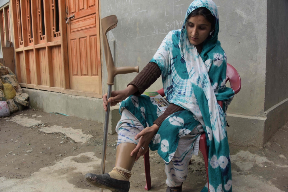 FILE PHOTO: Pakistani Kashmiri Salima Bibi, 24, a victim of landmine wearing an artificial limb before giving an awareness campaign talk to local residents at a village in Pakistan-controlled Kashmir. AFP / Sajjad Qayyum