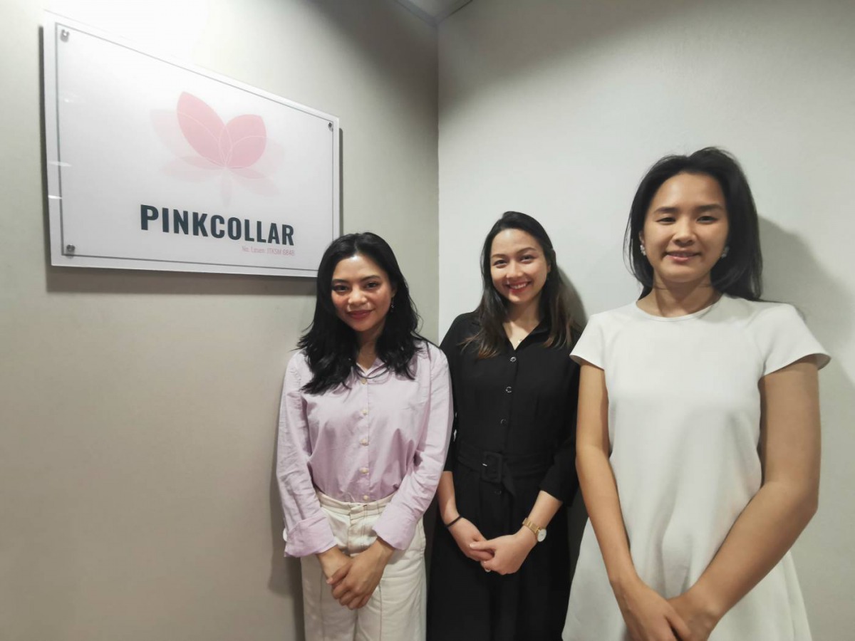 The founding team of Pinkcollar, which billed itself as first Malaysian ethical recruitment agency aimed at tackling debt bondage among migrant domestic workers, pose for a photo at its office in Kuala Lumpur, October 3, 2019. Thomson Reuters Foundation/B
