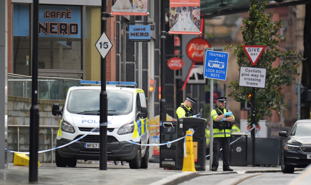 Police officers are seen outside the Arndale shopping centre after several people were stabbed in Manchester, Britain October 11, 2019. (REUTERS/Peter Powell)