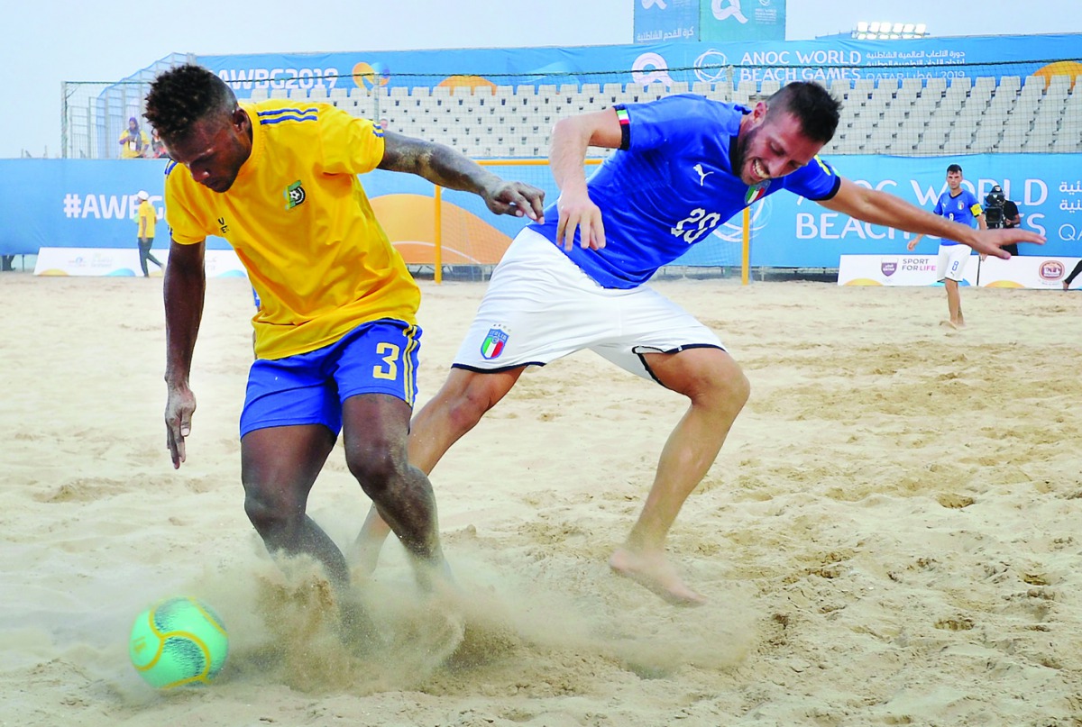 Italian and Solomon Islands players in action during their Beach Soccer match played at Katara Beach. 
Pic:Salim Matramkot/ The Peninsula