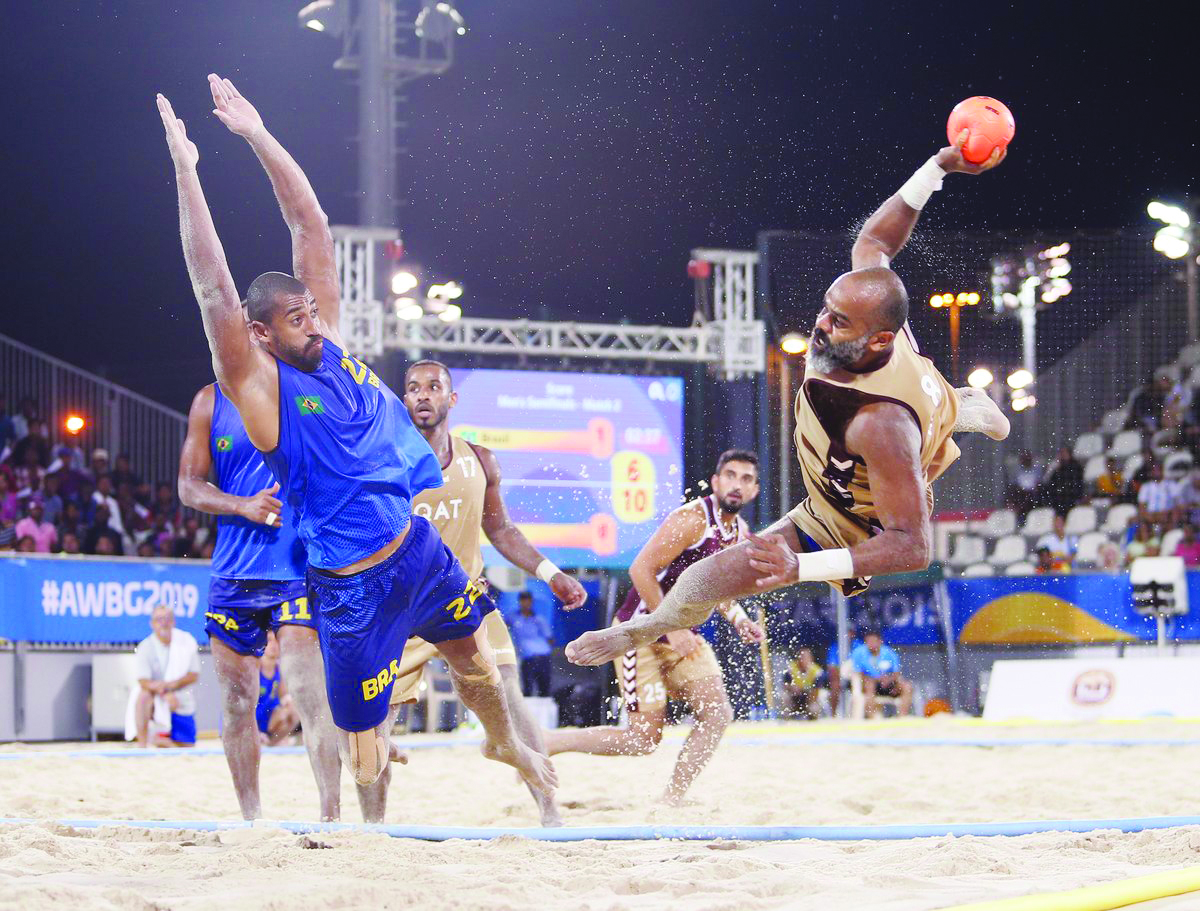 Qatar’s Mohamed Hassan attempts to score a goal against Brazil during their semi-final of men’s beach handball at the first ANOC World Beach Games Qatar 2019, yesterday. 