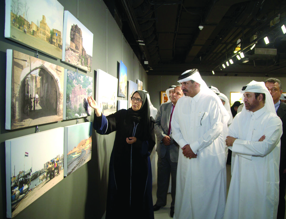 Qatari photographer, Modhi Hamad Al Hajri (left), takes Mohamed bin Ahmed bin Towar Al Kuwari (centre), First Vice-Chairman of Qatar Chamber, and Dr. Khalid bin Ibrahim Al Sulaiti (right), on a tour of her solo exhibition “Yemen, A Captivating Love”, yest