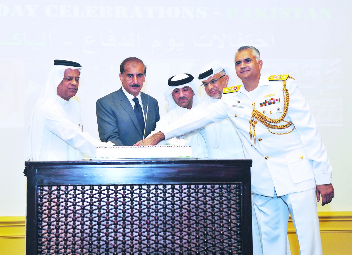 Ambassador of Pakistan to Qatar, Syed Ahsan Raza Shah (second left), cutting a cake with Brig Gen Khalid Mohammad Al Halbadi, Chief Protocol officer of Qatar Armed Forces; Brig Gen Hamid Hussain Al Sayari, Director of Evaluation at Qatar Armed Forces, and