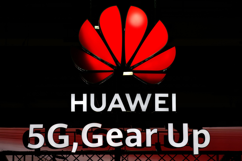 Illuminated Huawei and 5G signs are on display during the 10th Global mobile broadband forum hosted by Chinese tech giant Huawei in Zurich in this file picture. 