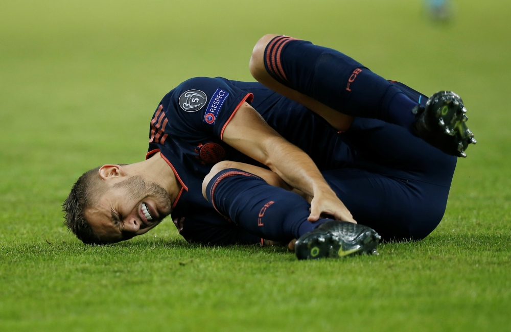 Bayern Munich's Lucas Hernandez reacts after sustaining an injury. Reuters/Costas Baltas 
