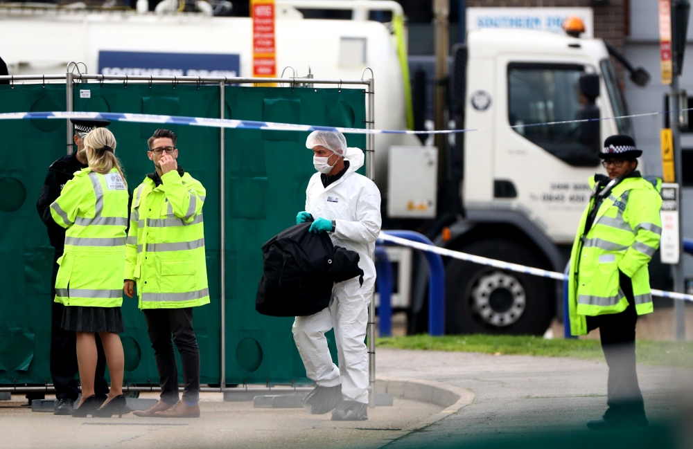 Police is seen at the scene where bodies were discovered in a lorry container, in Grays, Essex, Britain October 23, 2019. Reuters/Hannah McKay
 