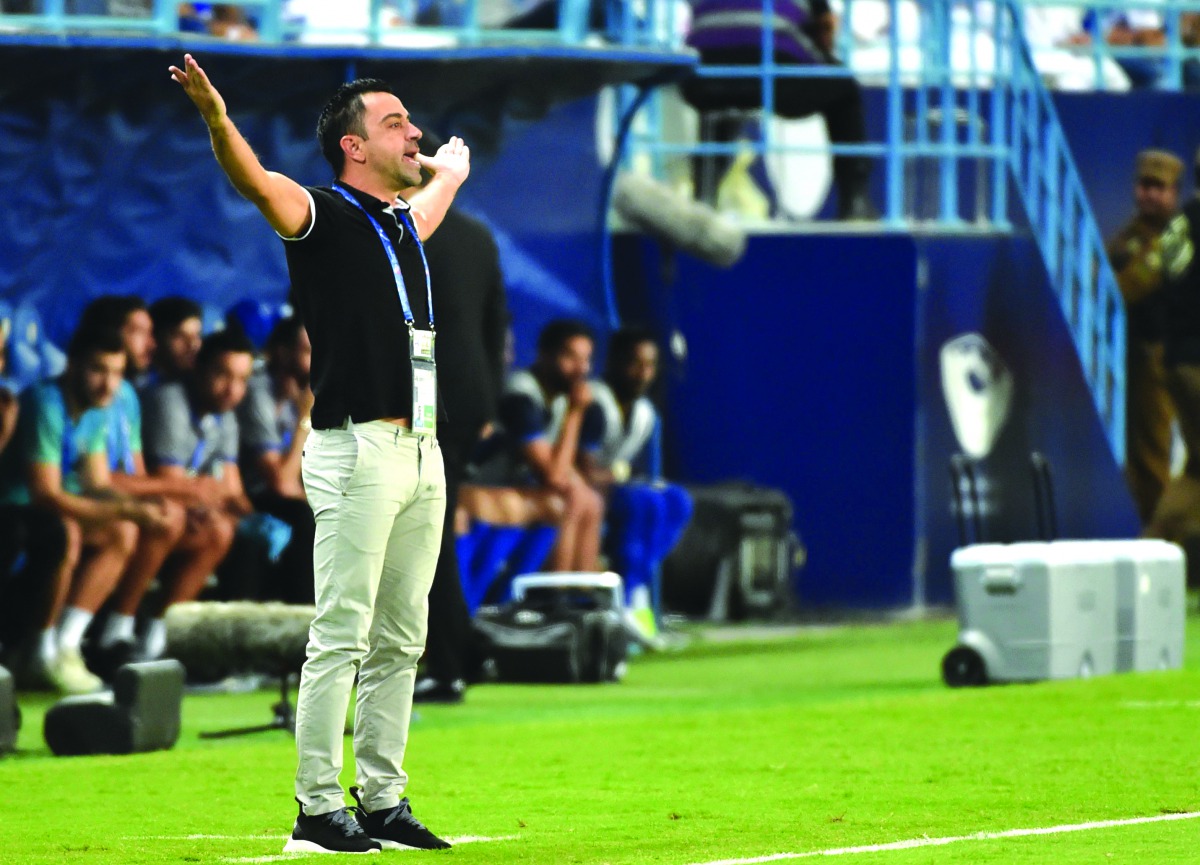 Al Sadd’s Spanish coach Xavi Hernandez gestures during the second leg of the AFC Champions League semi-final match against Saudi’s Al Hilal in Riyadh on Tuesday.