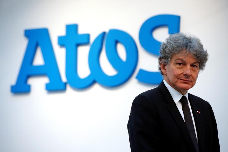 FILE PHOTO: Atos Chairman and CEO Thierry Breton poses in front of the company's logo during a presentation of the new Bull sequana supercomputer in Paris, France, April 12, 2016. REUTERS/Philippe Wojazer