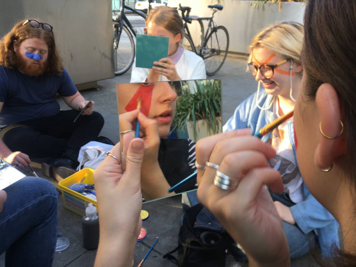 Members of The Dazzle Club apply face make-up to avoid facial recognition by CCTV cameras in London on September 19, 2019. Photo credit: The Dazzle Club