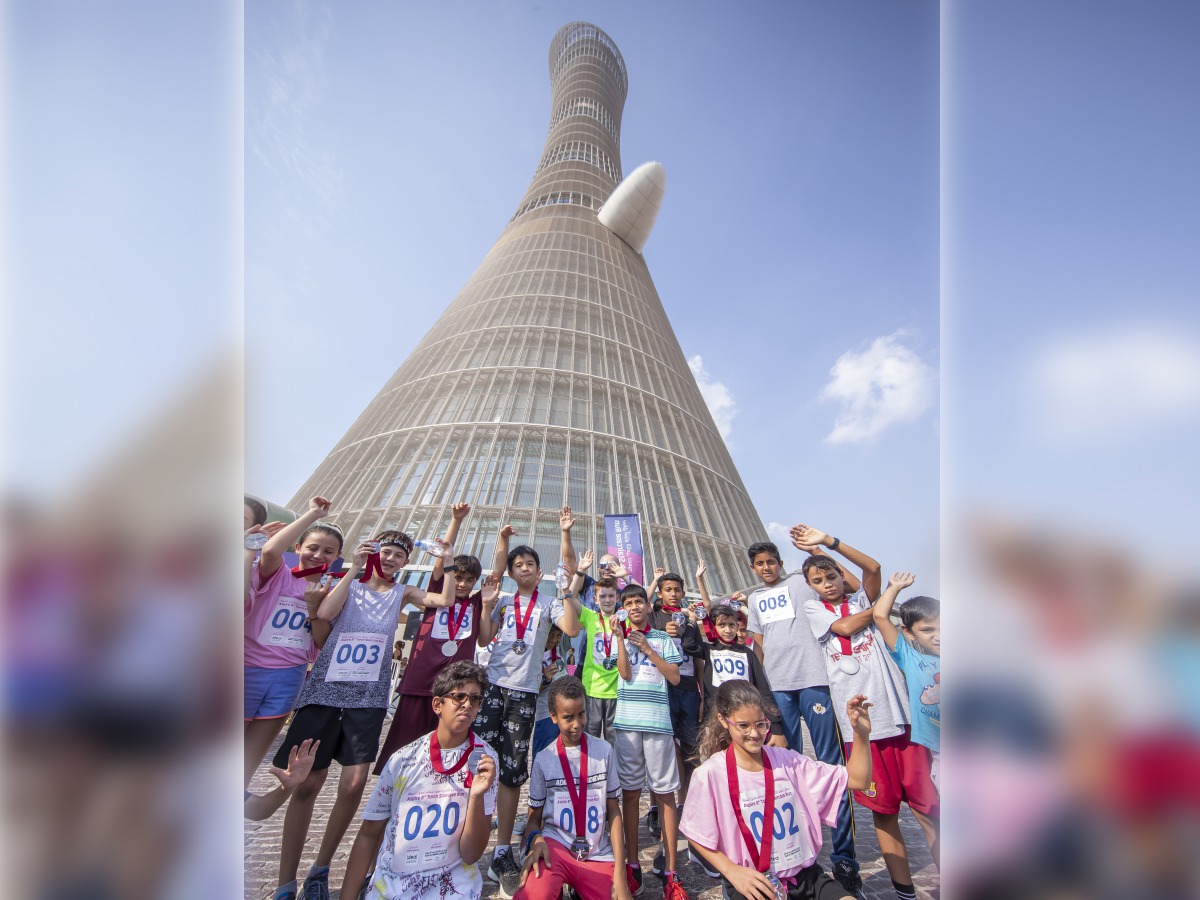 Participants of 8th edition of Aspire Torch Staircase Run pose for a photo.