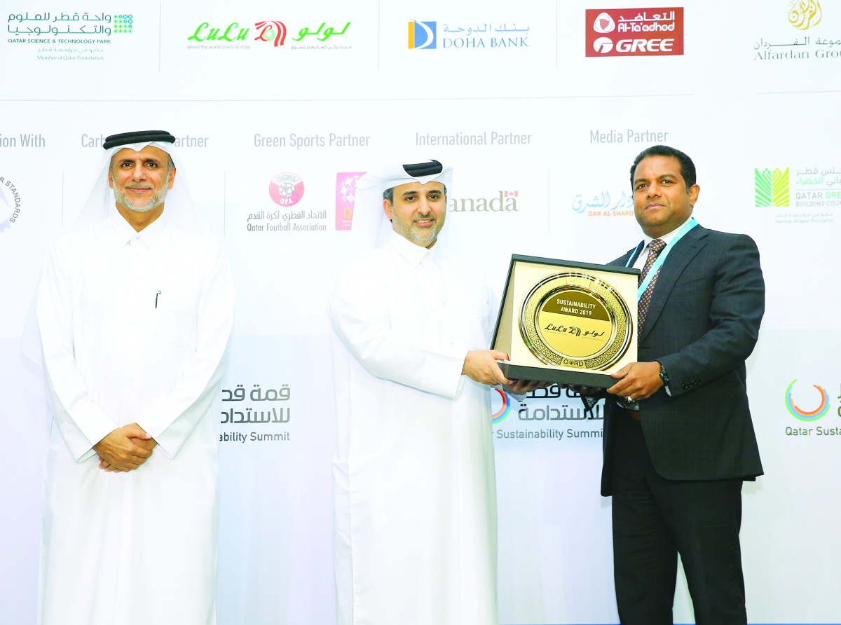 Minister of Municipality and Environment, H E Eng. Abdullah bin Abdulaziz bin Turki Al Subaie, giving the award to Mohamed Althaf, Director of Lulu Group International, at St. Regis Hotel Doha, in the presence of Dr Yousef Alhorr, Founding Chairman of Gul