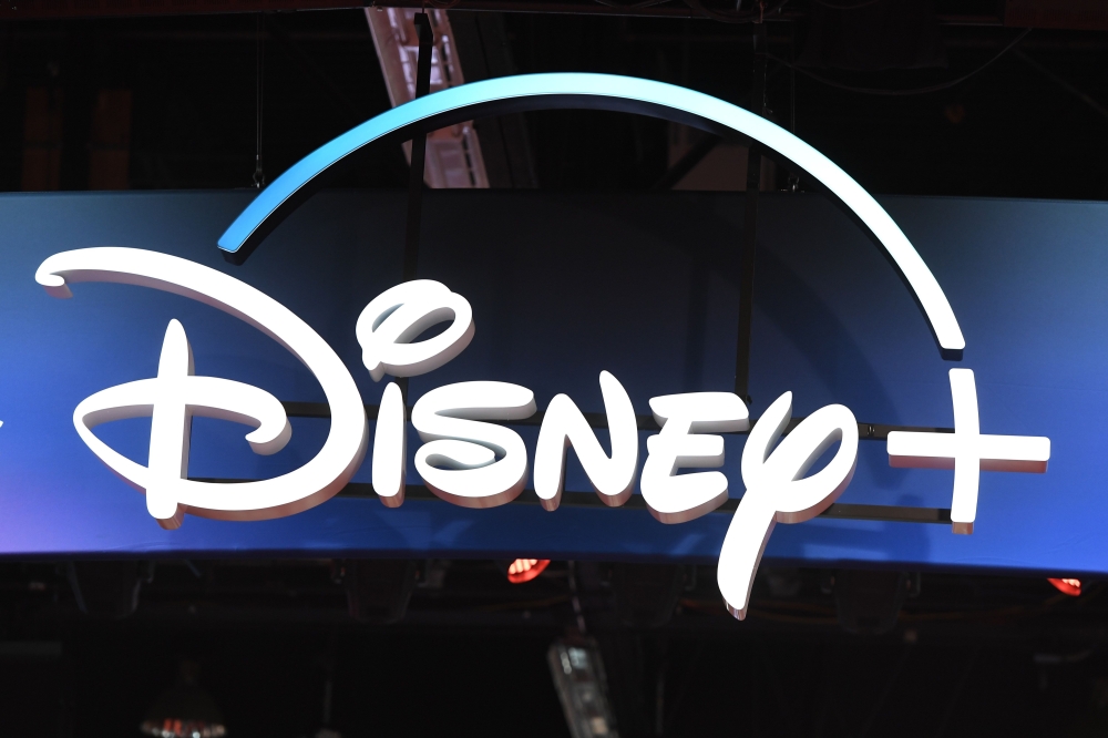 (FILES) In this file photo taken on August 23, 2019, a Disney+ streaming service sign is pictured at the D23 Expo, billed as the 