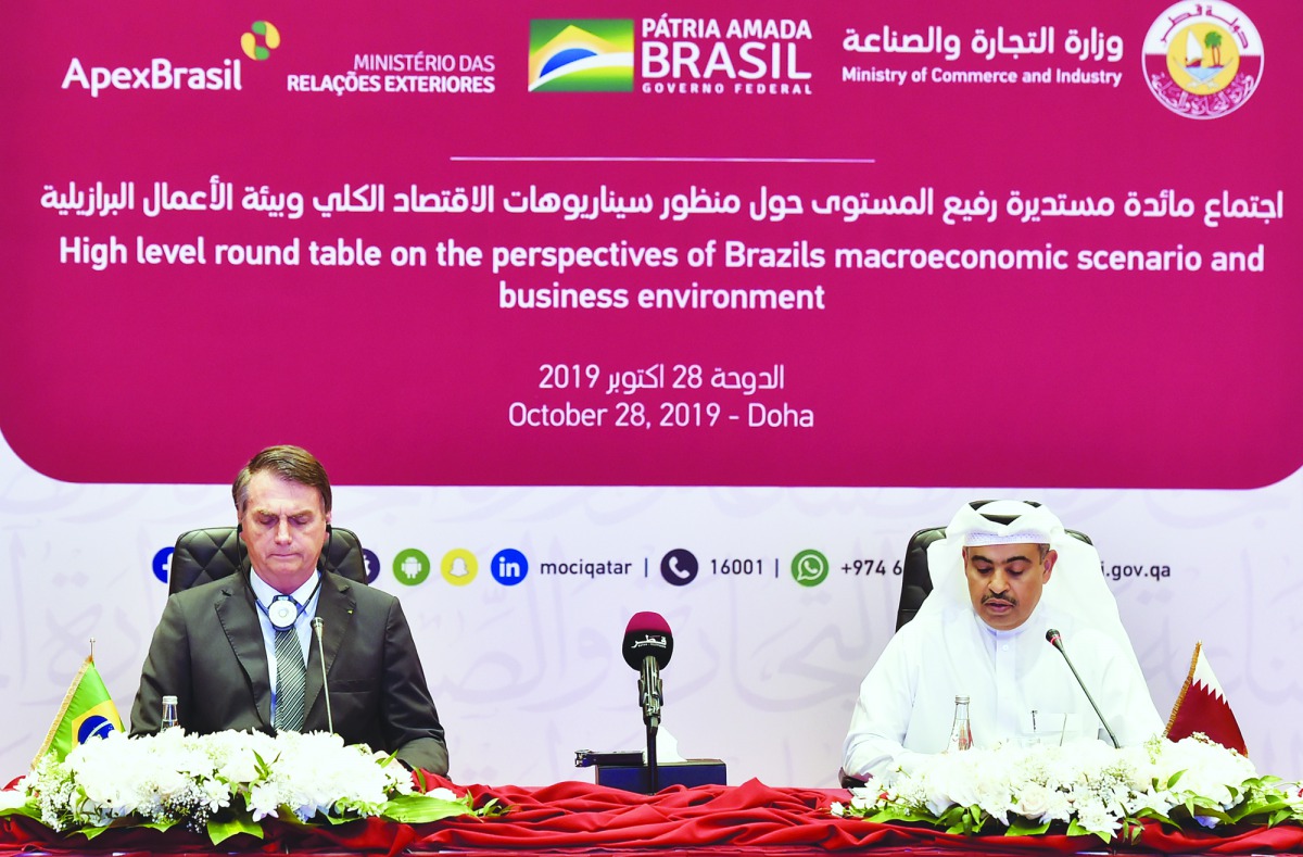 The President of Brazil, Jair Bolsonaro (left) and H E Ali bin Ahmed Al Kuwari, Minister of Commerce and Industry, at the roundtable meeting with top officials from Qatar and Brazil at Sheraton Hotel-Doha, yesterday.