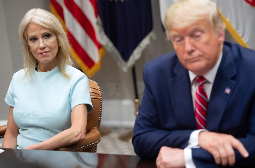 Donald Trump sits alongside Kellyanne Conway during a meeting on the opioid epidemic in the Roosevelt Room of the White House on June 12, 2019. AFP / Saul Loeb