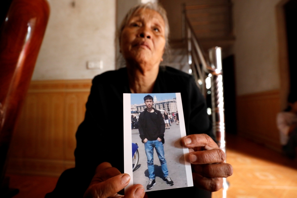 Anna Tran Thi Giao, grandmother of Vietnamese Joseph Nguyen Dinh Luong who is one of the suspected victims of the 39 people found dead in a refrigerated truck in Britain, reacts at her home in Ha Tinh province, Vietnam October 27, 2019. Reuters/Kham