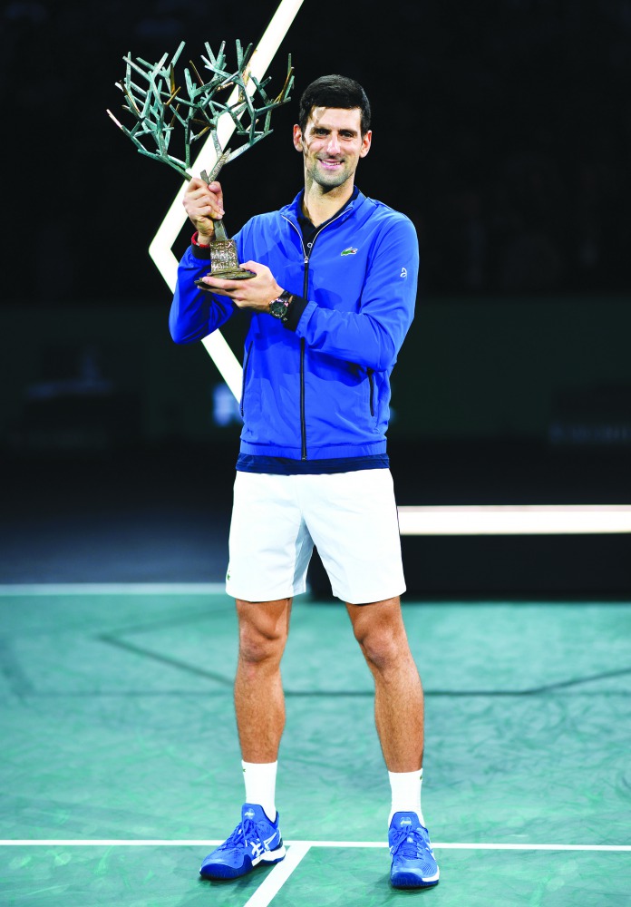 Novak Djokovic of Serbia holds winner trophy after winning final match against Denis Shapovalov of Canada during their final match at the Rolex Paris Masters tennis tournament at AccorHotels Arena in Paris. November 03, 2019. (Mustafa Yalç?n/Anadolu Agenc