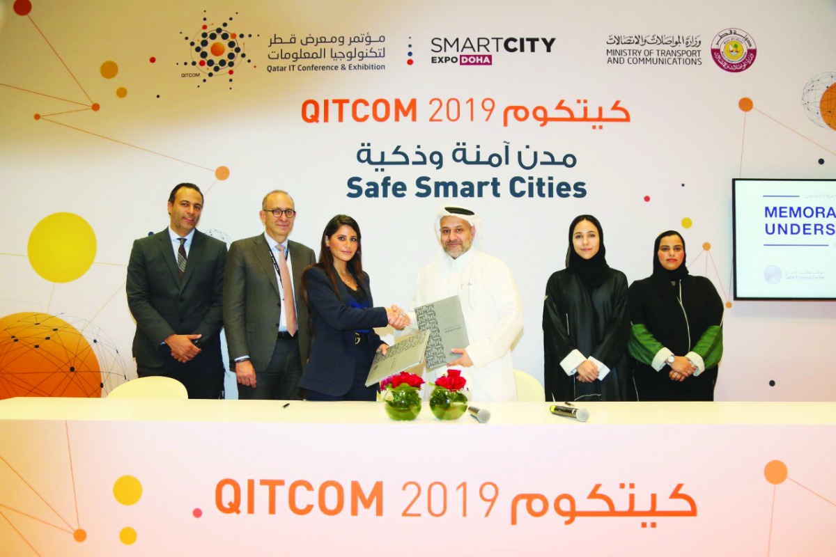 Yousuf Mohamed Al Jaida (third right), Chief Executive Officer, QFC, and Lana Khalaf (third left), Country Manager, Microsoft Qatar, and other officials during the signing ceremony.