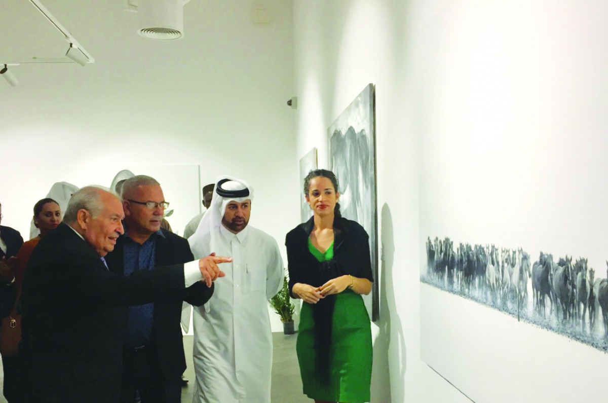 Eumelio Caballero Rodríguez, Ambassador of Cuba to Qatar; Cuban artist Juan Arel Ruiz Contino and Dr. Khalid bin Ibrahim Al Sulaiti, General Manager of Katara, at the opening of “Face to Face” exhibition at Katara Building 47 on Saturday. Pic: Raynald C R