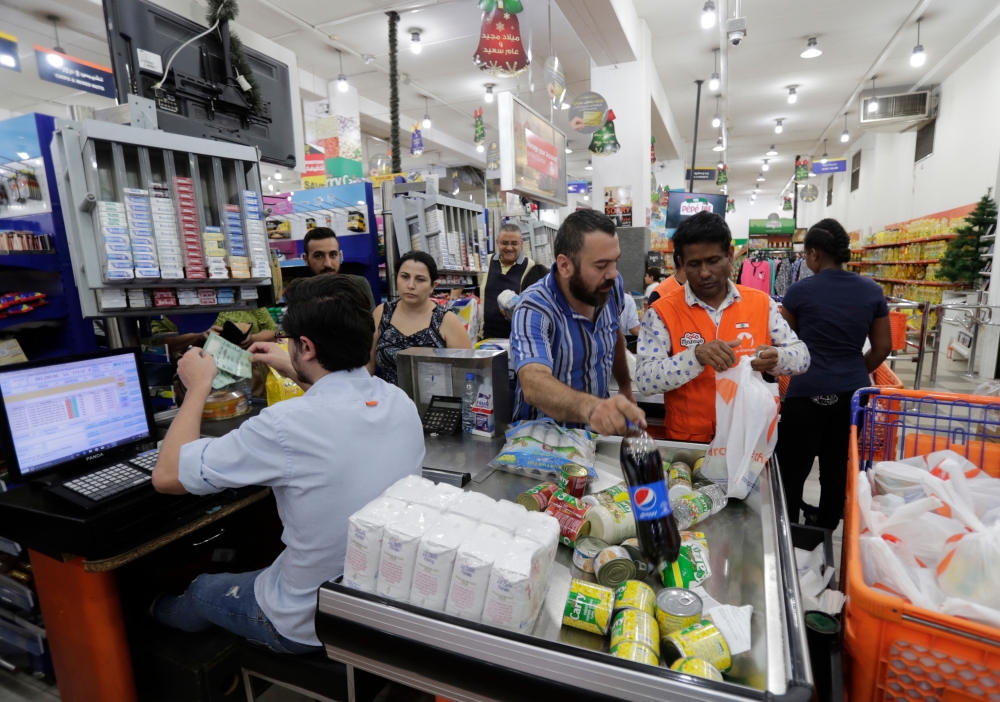 People shop at a supermarket in the Lebanese capital Beirut on November 9, 2019. AFP / Anwar Amro
 