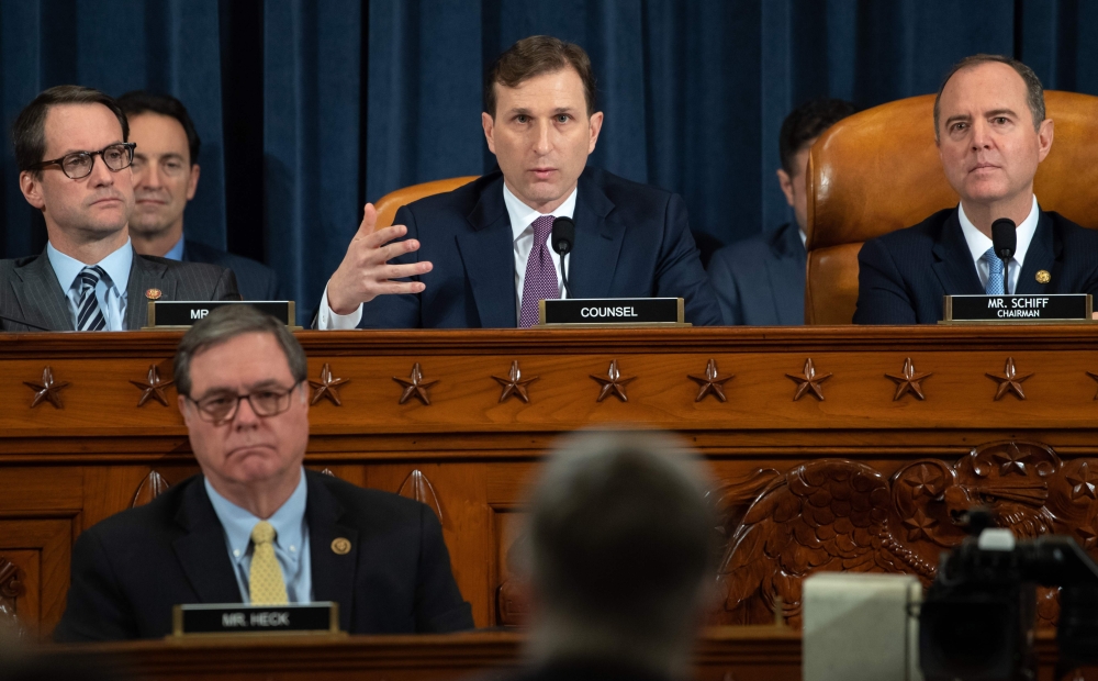 Democratic Counsel Daniel Goldman (C), alongside Chairman Adam Schiff (R), Democrat of California, asks questions of witnesses US Ambassador to Ukraine William Taylor and Deputy Assistant Secretary George Kent during the first public hearings held by the 