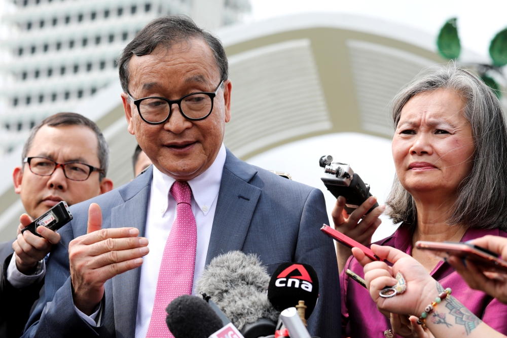 FILE PHOTO: Self-exiled Cambodian opposition party founder Sam Rainsy speaks to journalists in Kuala Lumpur, Malaysia, November 12, 2019. REUTERS/Lim Huey Teng/File Photo