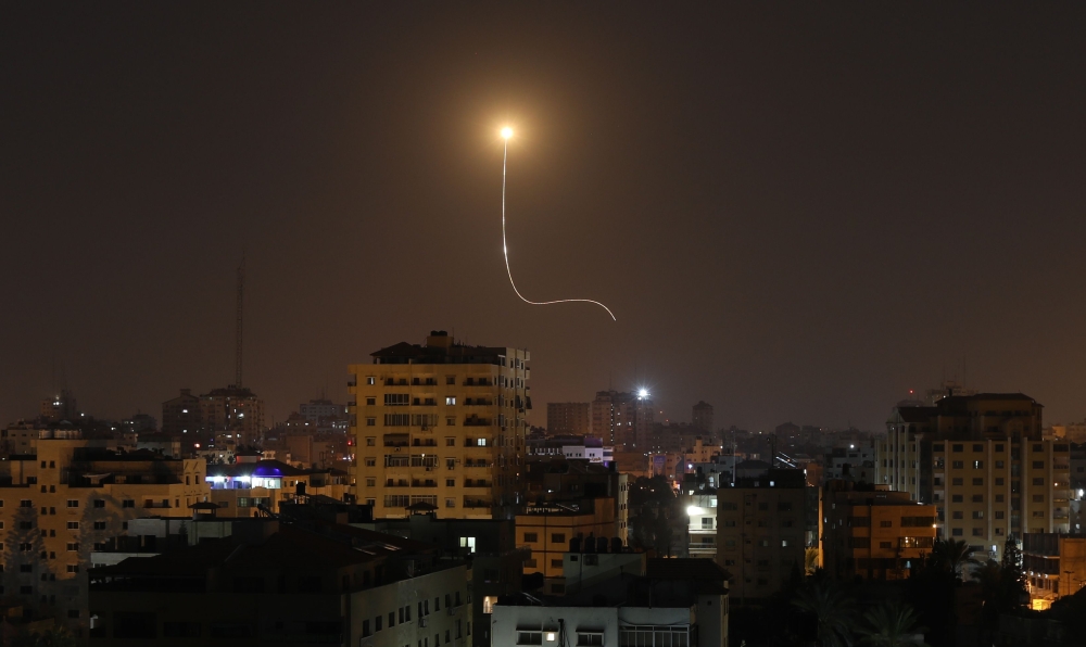 Israeli missile launched from the Iron Dome defence missile system, designed to intercept and destroy incoming short-range rockets and artillery shells, is seen above Gaza city on November 13, 2019. / AFP / MAHMUD HAMS