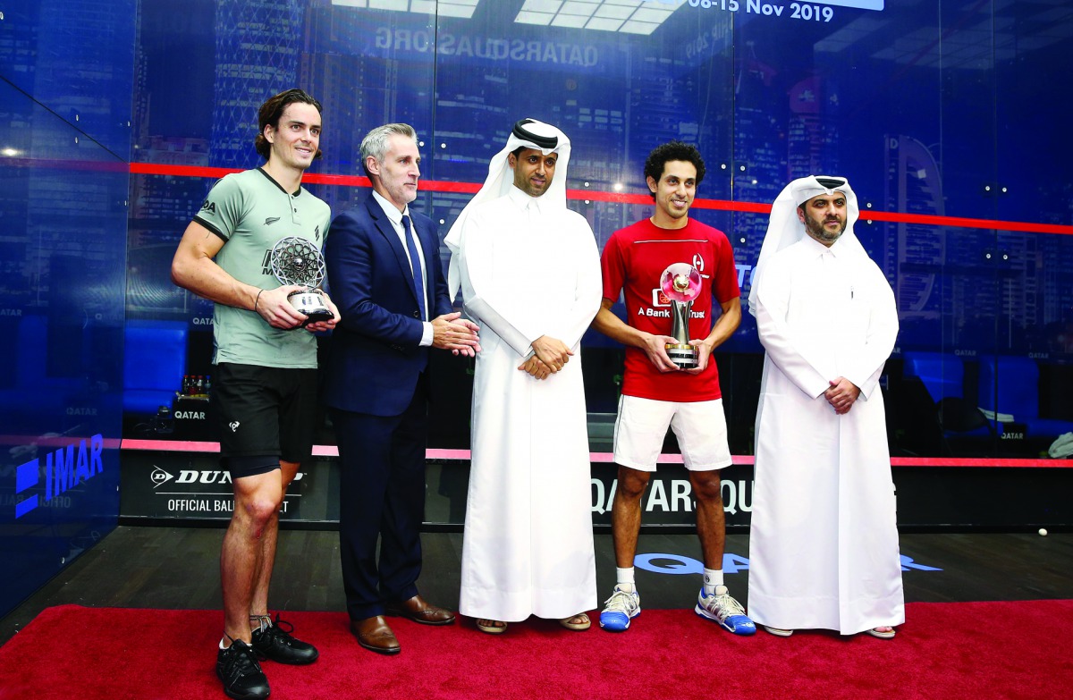 PSA World Championship winner Tareq Monen (second right) poses for a picture with Qatar Tennis, Squash and Badminton Federation (QTSBF) President, Nasser Al Khelaifi (centre), Secretary-General of QTSBF Tariq Zainal (right) and Professional Squash Associa
