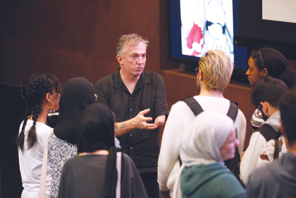 Giles Duley speaking to NU-Q students.