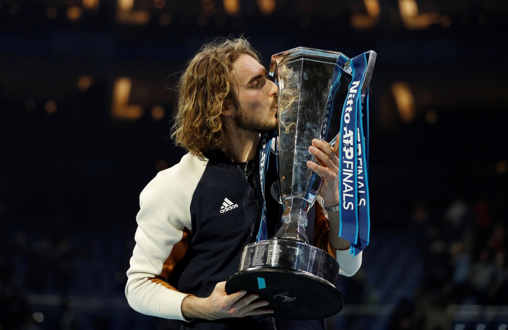 Tennis - ATP Finals - The O2, London, Britain - November 17, 2019 Greece's Stefanos Tsitsipas celebrates winning the ATP Finals with the trophy REUTERS/Peter Nicholls
