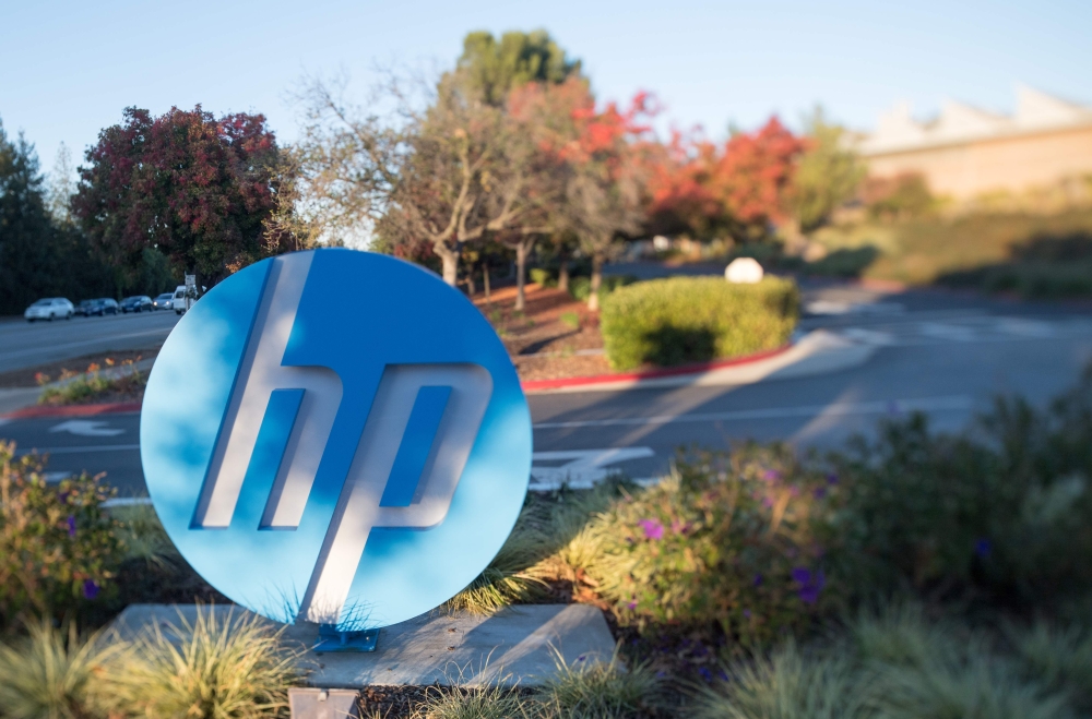 In this file photo taken on November 4, 2016 the HP logo is seen on a sign at Hewlett Packard's headquarters in Palo Alto, California. 
/ AFP / JOSH EDELSON

