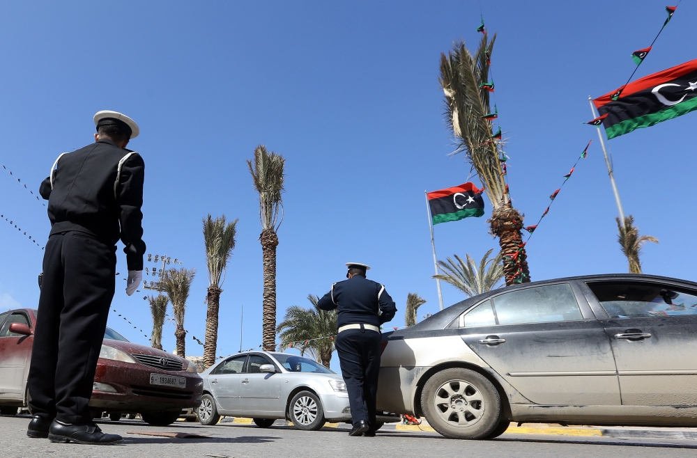 File photo of Libyan traffic police directing cars during an operation at the Martyrs Square in Tripoli on March 12, 2019. AFP / Mahmud Turkia.jpeg 
