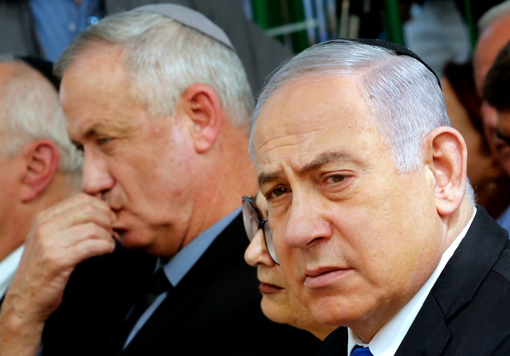 Benjamin Netanyahu, Israeli president of the Supreme Court Esther Hayut and Benny Gantz attend a ceremony for late Israeli president Shimon Peres at Mount Herzl on September 19, 2019. AFP / Gil Cohen-Magen
