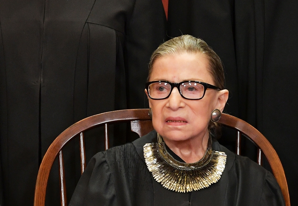 In this file photo taken on November 30, 2018 Associate Justice Ruth Bader ginsburg poses for the official photo at the Supreme Court in Washington, DC. Justice Ruth Bader ginsburg has been hospitalized November 23, 2019, after experiencing chills and fev