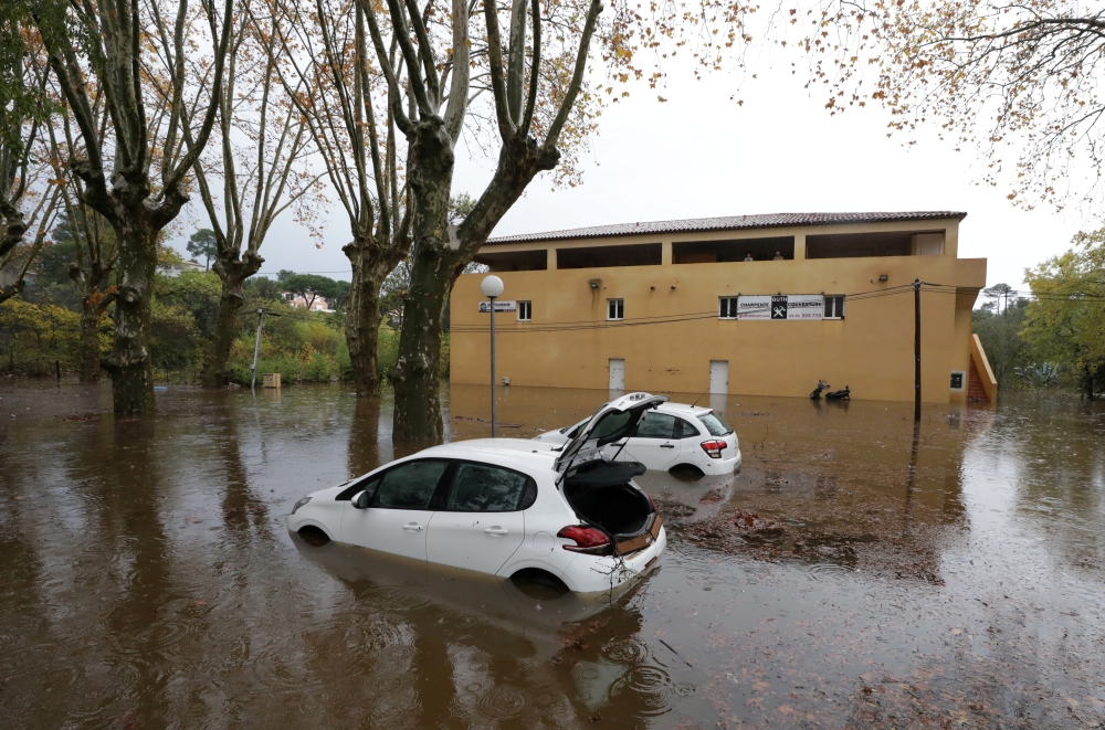 Cars are seen on a flooded street after heavy rain fall in Roquebrune-sur-Argens, France, November 24, 2019. REUTERS/Eric Gaillard