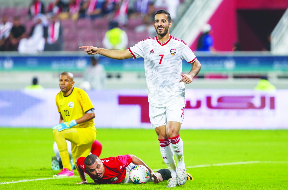 UAE’s forward Ali Mabkhout celebrates after scoring a goal against Yemen during their Group A match of the 24th Arabian Gulf Cup at the Abdullah bin Khalifa Stadium in Doha, yesterday.